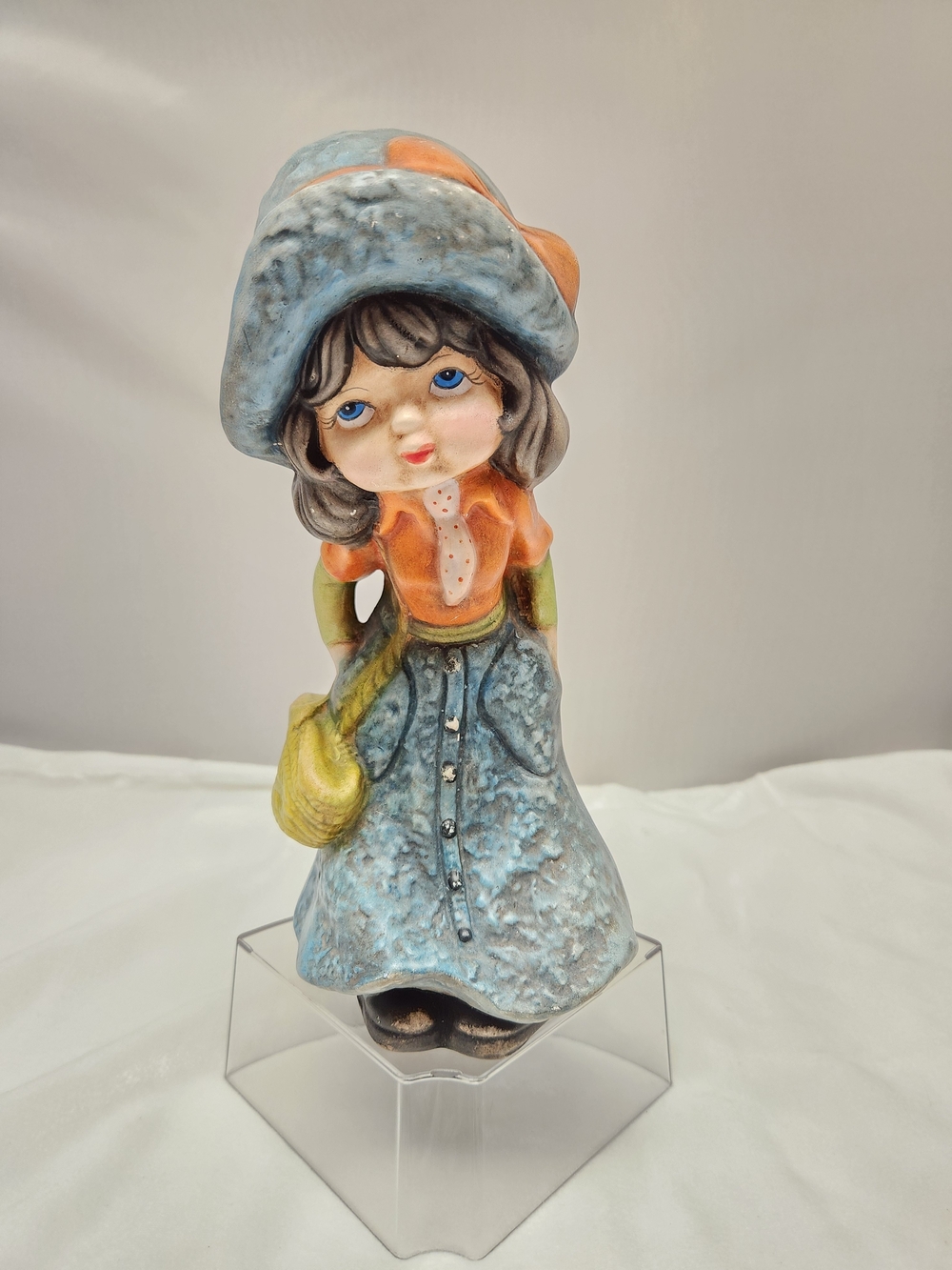 Whimsical Ceramic Girl Sculpture in Blue and Orange